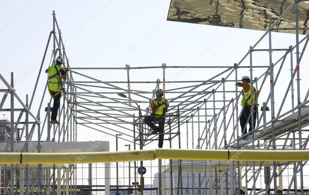 Workers building a scaffold