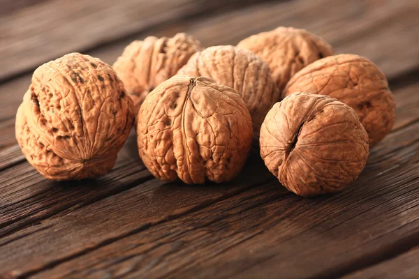 Walnuts on an old table — Stock Photo, Image