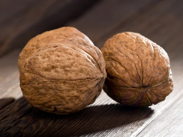 Walnuts on an old table — Stock Photo, Image