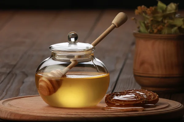 Honey on a brown table — Stock Photo, Image