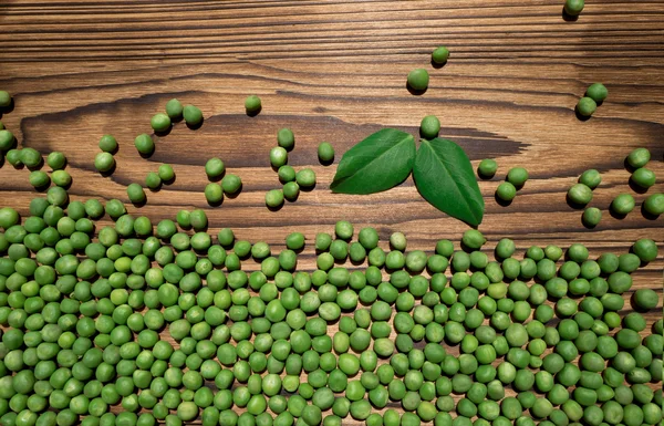 Peas on table — Stock Photo, Image