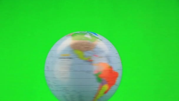 Rotating globe on green — Stock Video