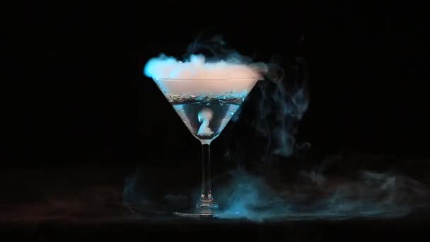 Glass of water with ice vapor — Stock Video