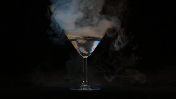 Glass of water with ice vapor — Stock Video