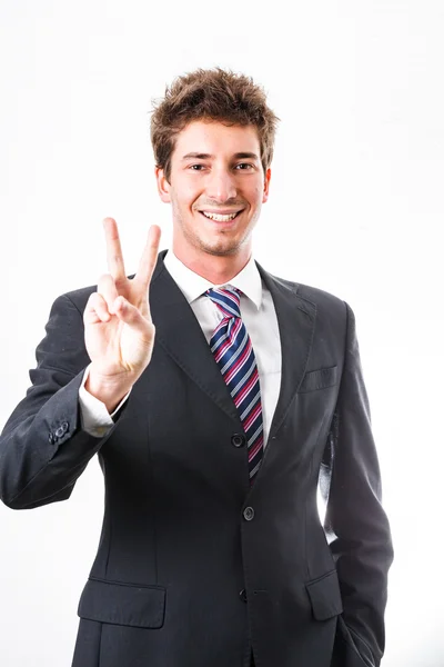 Молодой бизнесмен показывает жест и выражение лица — стоковое фото