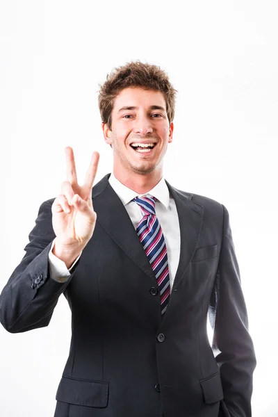 Молодой бизнесмен показывает жест и выражение лица — стоковое фото