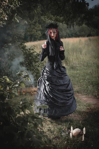 Witch in a dark forest — Stock Photo, Image