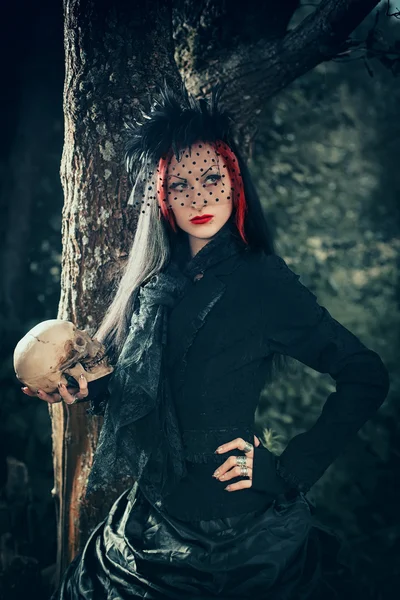 Witch in a dark forest — Stock Photo, Image