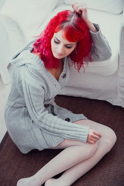 The girl sitting in an armchair — Stock Photo, Image