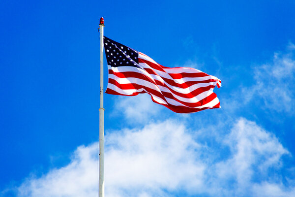 American flag and blue sky