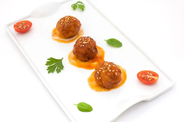 Meatballs on tomato — Stock Photo, Image