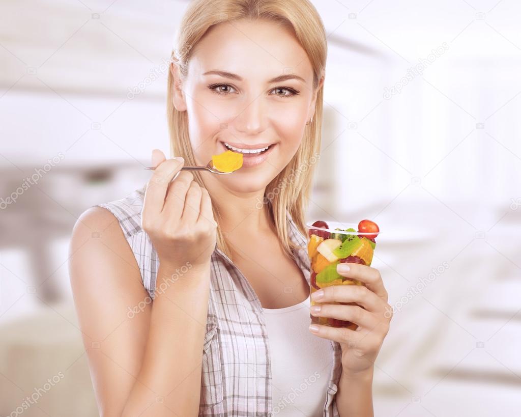 Happy woman eat fruit salad ⬇ Stock Photo, Image by © Anna_Om 102347502