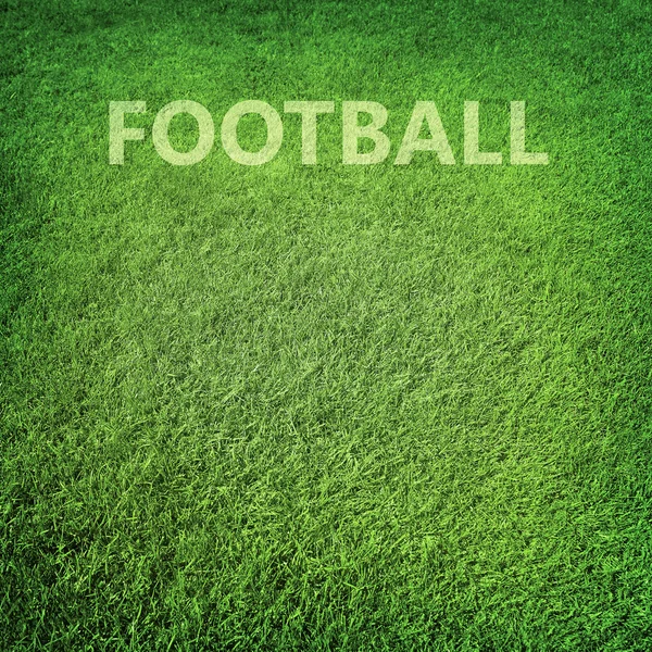 Zelené trávě fotbalové pozadí — Stock fotografie