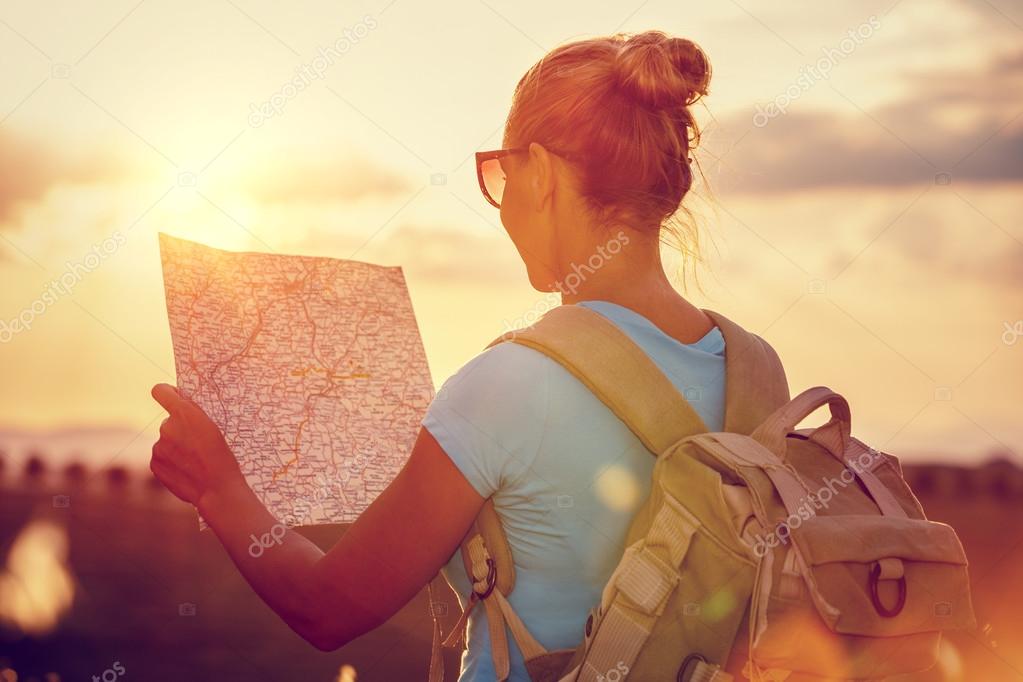 Traveler girl in sunset light