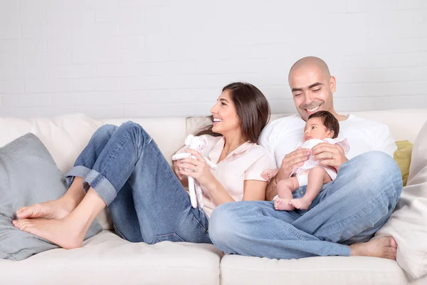 Young parents with little baby at home — Stock Photo, Image