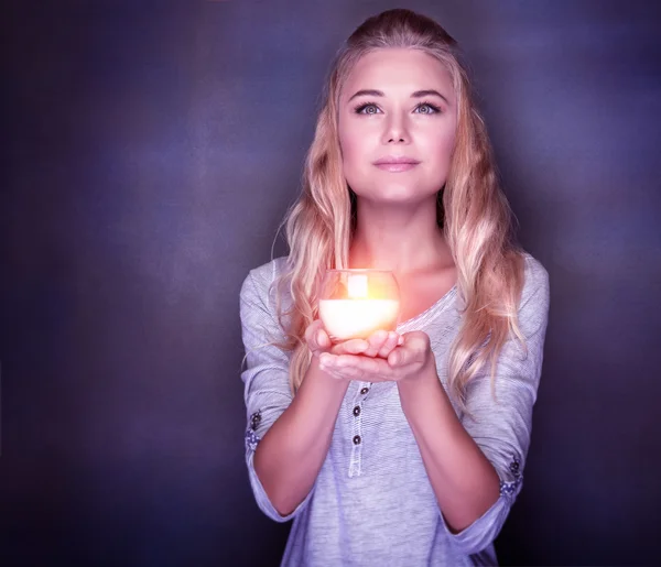 Attractive woman with candle — Stock Photo, Image