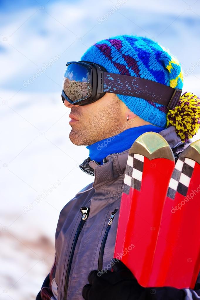 Handsome man enjoys ski resort