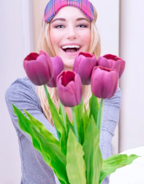 Happy female with flowers — Stock Photo, Image