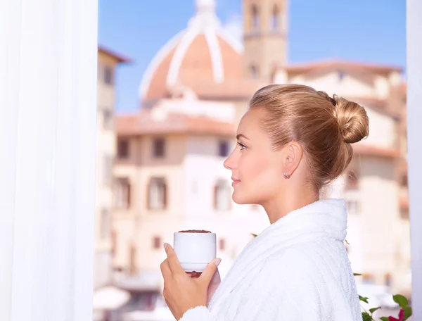 Drinking coffee on the balcony — Stock Photo, Image