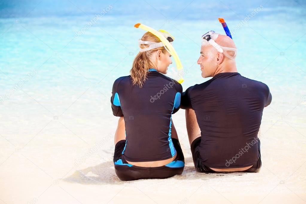 Happy diver on the beach