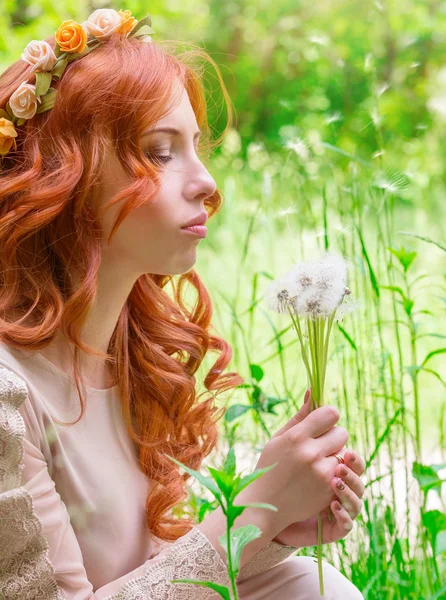 Dreamy woman with dandelions — Stock Photo, Image