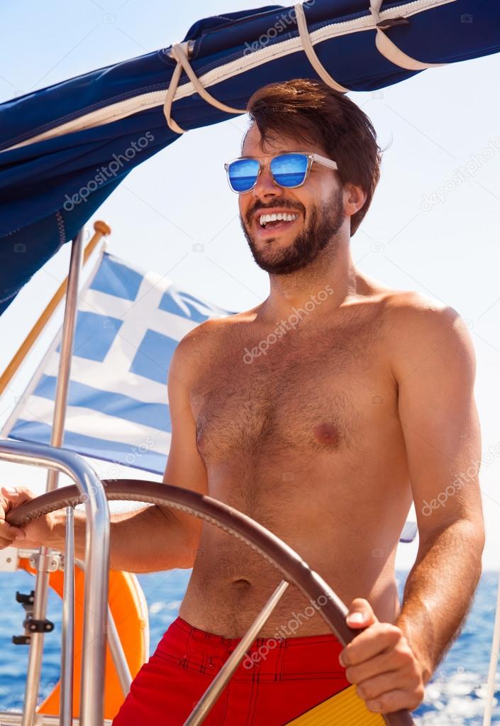 Sexy captain of sailboat