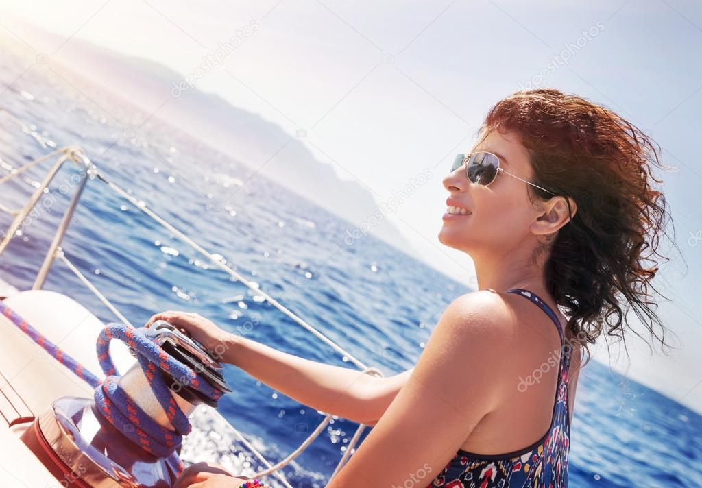 Beautiful woman on sailboat