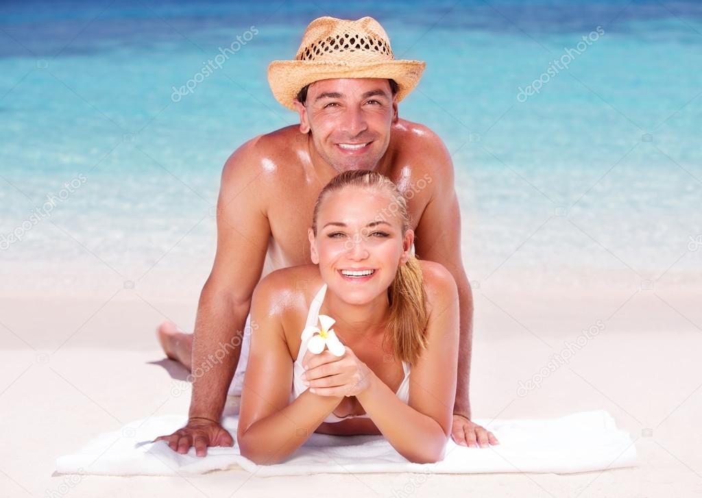 Cheerful couple on the beach