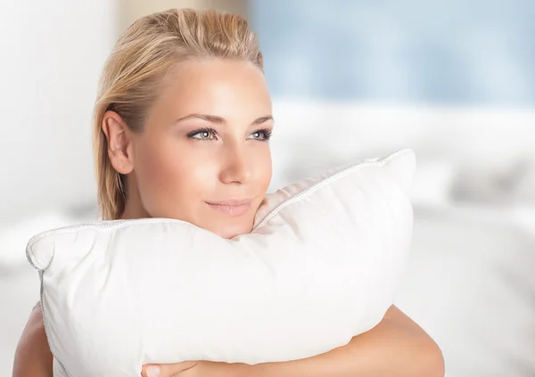 Girl enjoying soft pillow — Stock Photo, Image