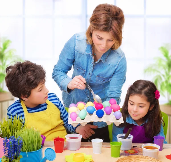 Happy family paint Easter eggs — Stock Photo, Image