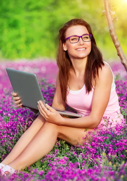 Cheerful student girl in the park — Stock Photo, Image