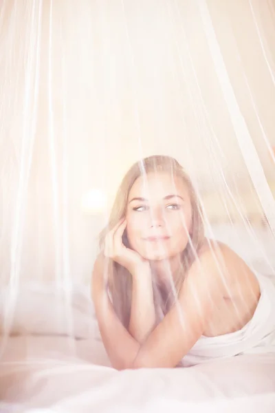 Dreamy woman in the bed — Stok fotoğraf