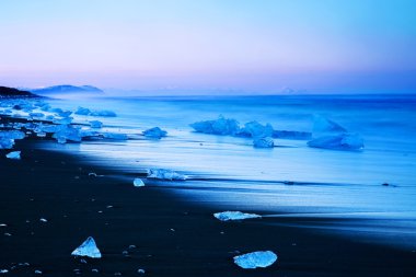 Iceberg on black sand beach of Iceland