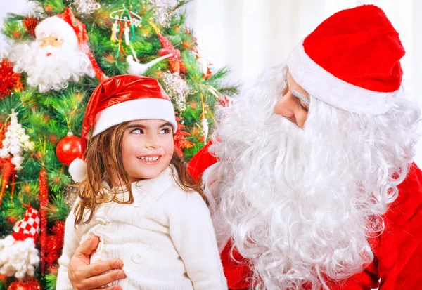 Little girl with Santa Claus Stock Image