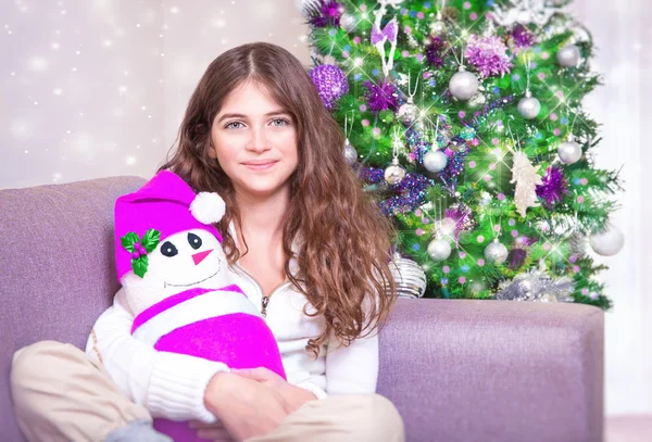 Happy girl near Christmas tree — Stock Photo, Image