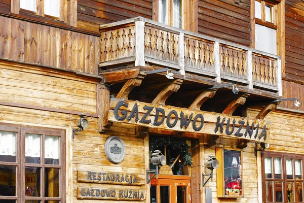 Restaurant's name over the entrance in Zakopane — Stock Photo, Image