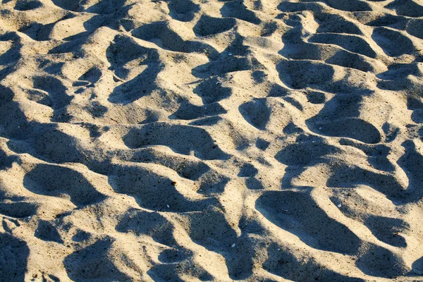 Powierzchnia plaży piasek w okresie letnim — Zdjęcie stockowe