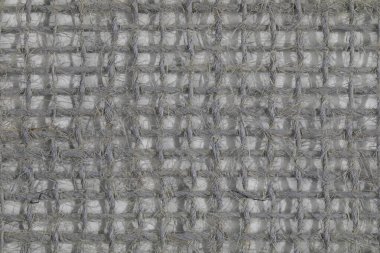 Kalın iplikle örülmüş tuval herhangi bir tasarım için boş bir arkaplan oluşturur.