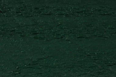 Boyanmış tahtanın yüzeyi herhangi bir tasarım için boş bir arkaplan oluşturur.