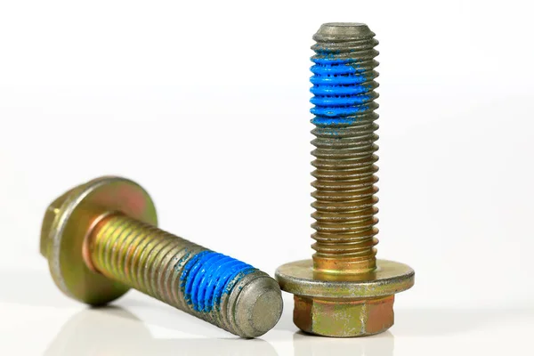 Two Identical Bolts Partially Painted Blue Which Industrial Items Spare — Stock Photo, Image