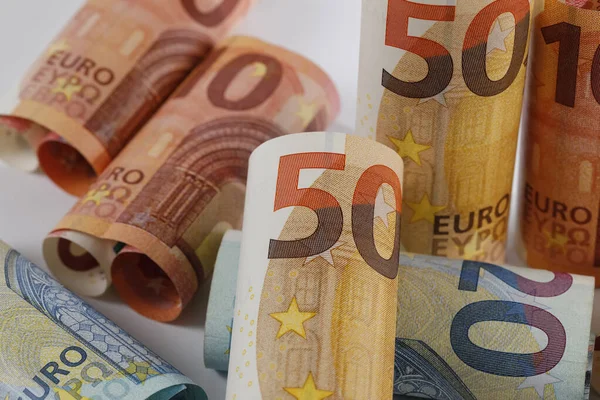 The image of rolled-up Euro banknotes. Euro banknotes are not made of paper, but of pure cotton fiber to improve their durability.