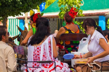 ANDUJAR,SPAIN - September, 6: Women typical Sevillian flamenca s clipart