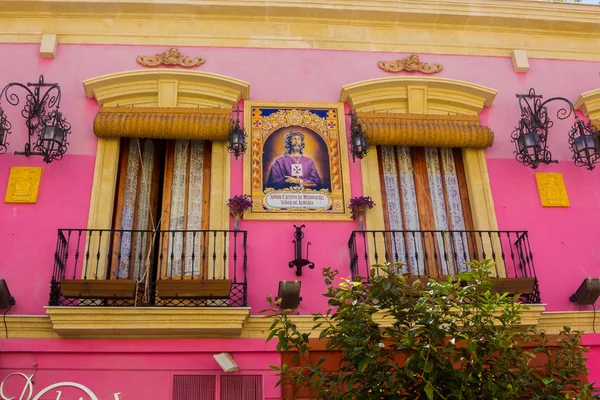 Pretty pink house with medinaceli christ lord of almeria — Stock Photo, Image