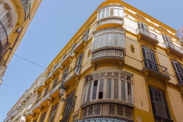Residential building with large windows on the terraces in the city of Malaga, Spain