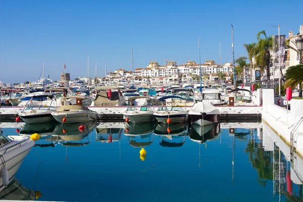 Sports boats and yachts with the city of Puerto Banus in the bac Stock Image
