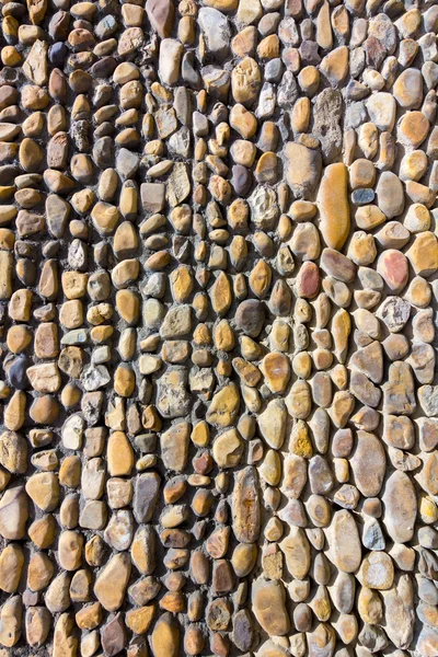 Duvar arka plan küçük taşlarla — Stok fotoğraf