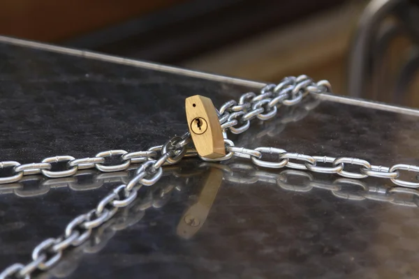 Chains attached by a padlock — Stock Photo, Image