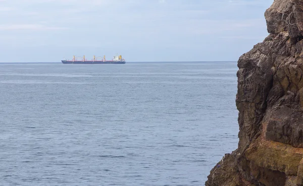 Merchant ship sailing by sea — Stock Photo, Image