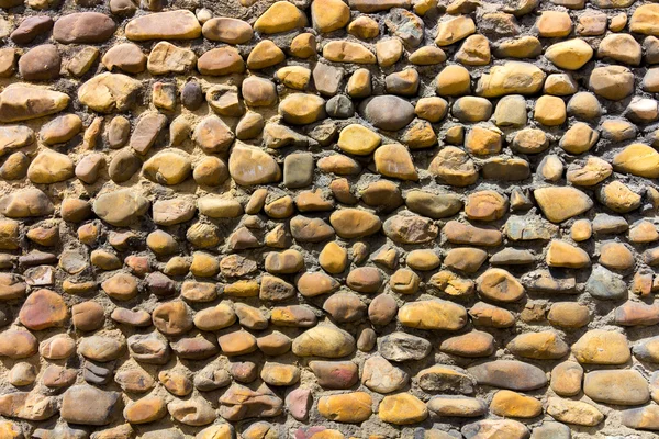 Wall background with small stones — Stock Photo, Image