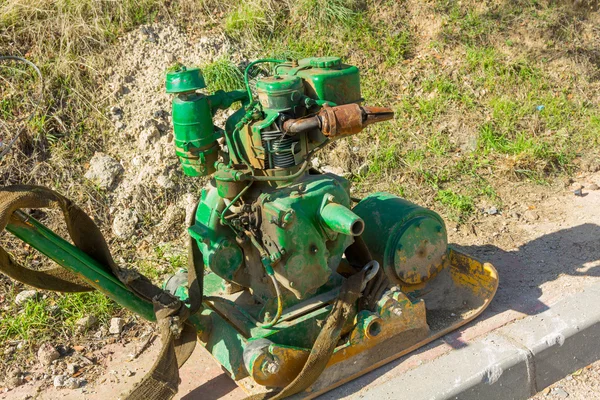 Old green bulldozer on a construction site — Stock Photo, Image